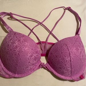 Front close bra with cross straps on back. Daisy lace. Like new